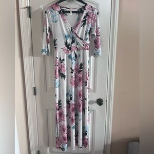 White floral maxi dress with pink and teal flowers.